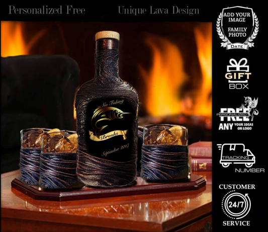 A personalized black whiskey decanter with a 3D lava design, accompanied by two whiskey glasses and two stone coasters, displayed on a table with a fireplace in the background. The decanter has 'Gone Fishing' text and a date.