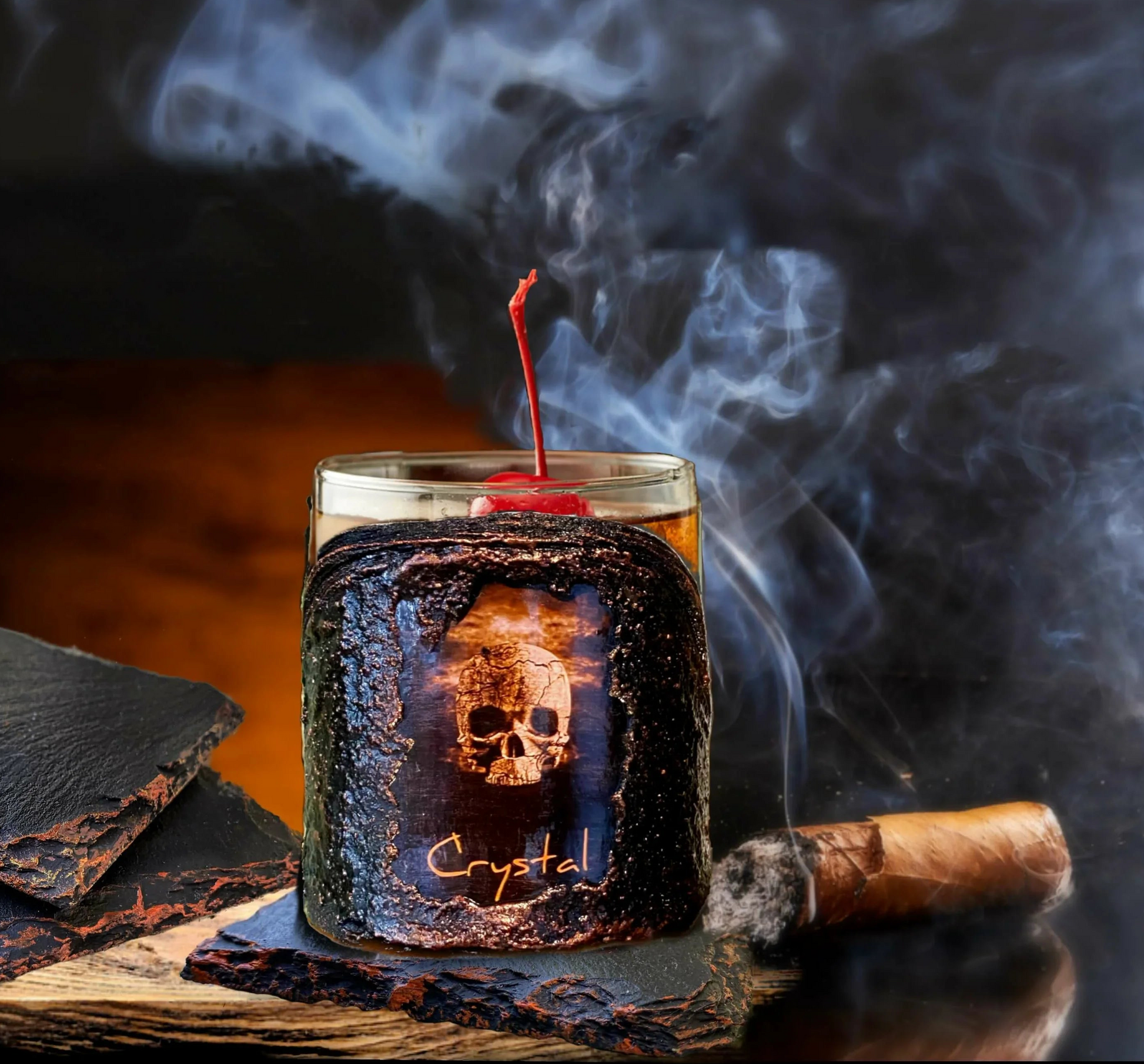 Glass with a cherry, skull design, and 'Crystal' text on a dark background with smoke.