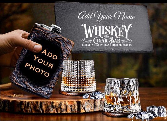 Whiskey flask and glasses with customizable text on a wooden surface
