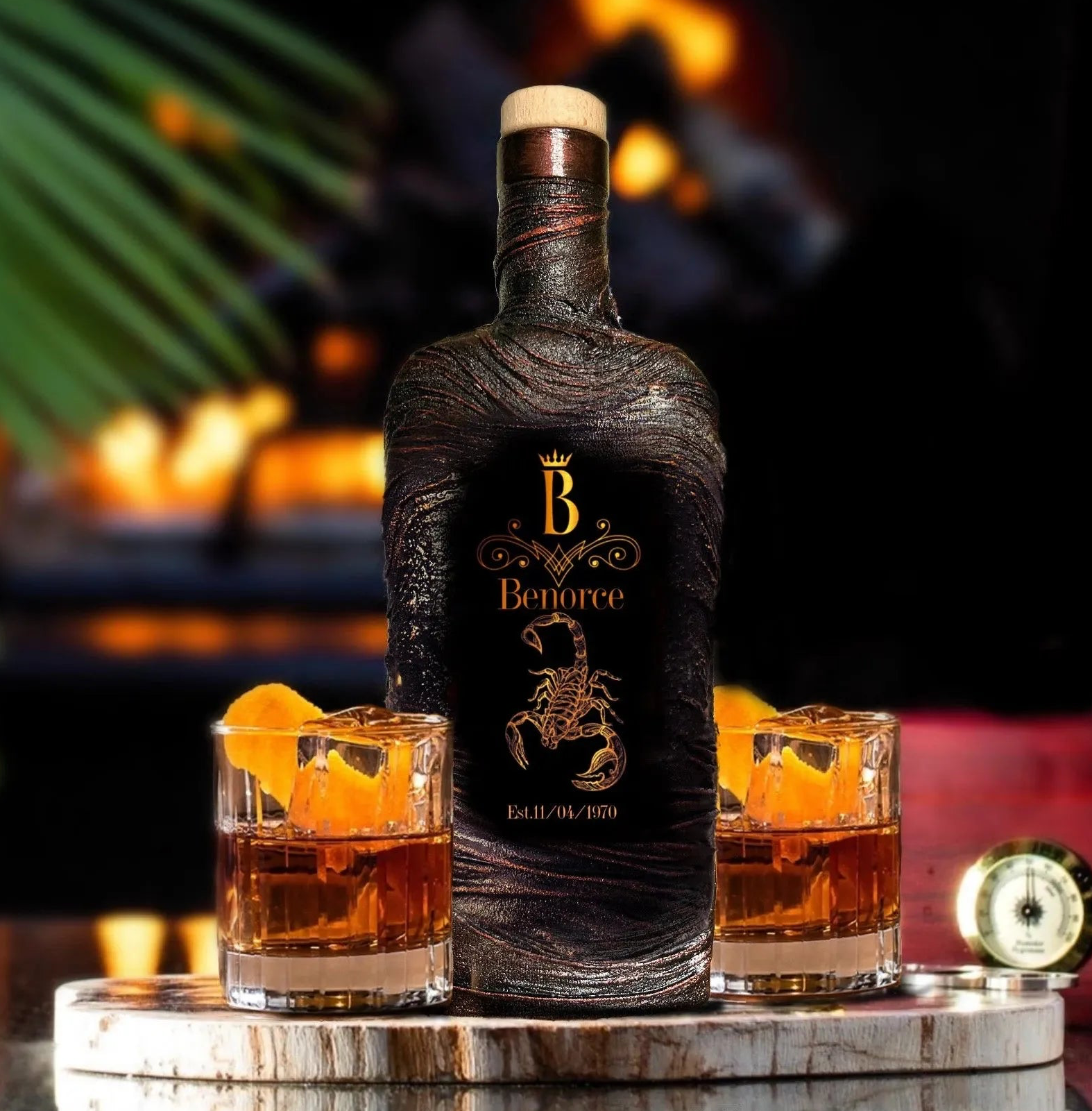 A black whiskey decanter with a customized image of a scorpion, alongside two whiskey glasses and six ice cubes, all placed on a silver tray.